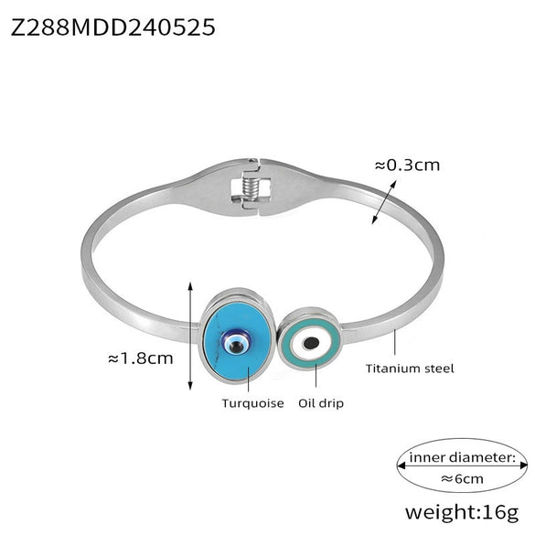 Wholesale Fashion Blue Eye Pattern Round Titanium Steel Goldplated Spring Bracelet Jewelry