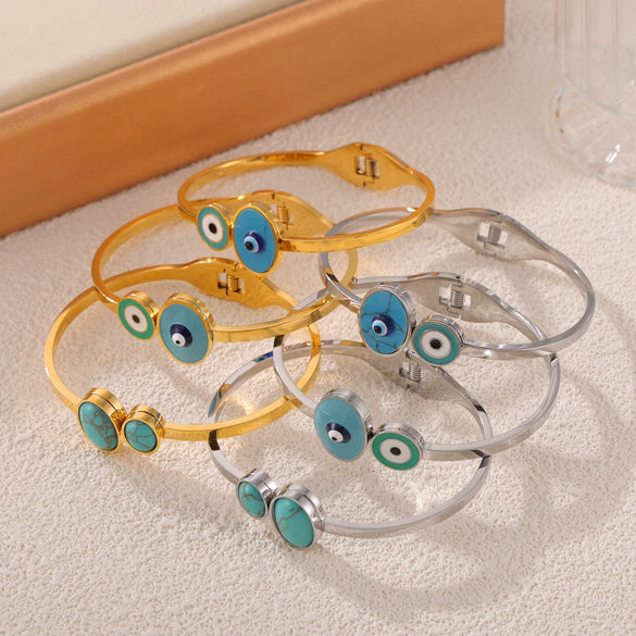 Wholesale Fashion Blue Eye Pattern Round Titanium Steel Goldplated Spring Bracelet Jewelry