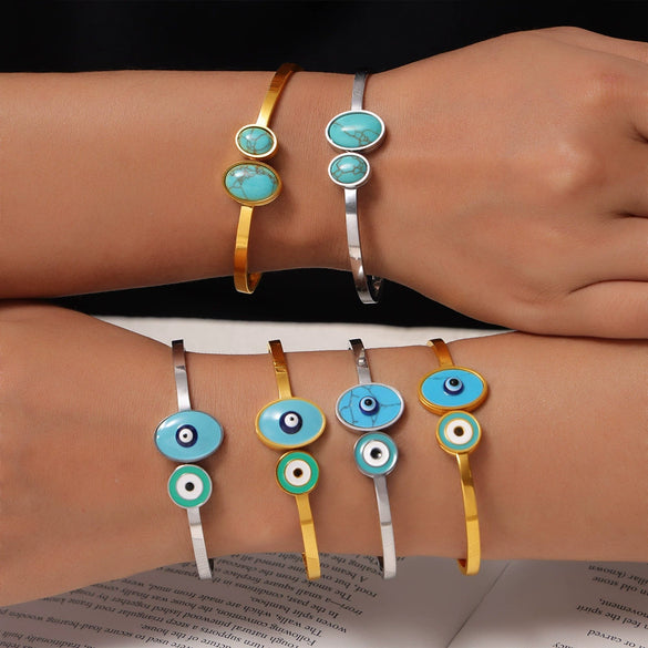 Wholesale Fashion Blue Eye Pattern Round Titanium Steel Goldplated Spring Bracelet Jewelry