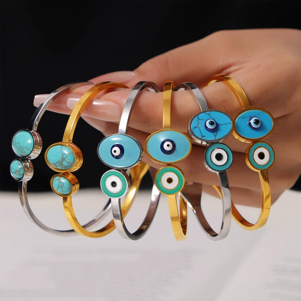 Wholesale Fashion Blue Eye Pattern Round Titanium Steel Goldplated Spring Bracelet Jewelry