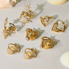 Wholesale Fashion Minimalist Stainless Steel Eightpointed Star Open Cut Out Ring With 18K Gold Electroplating For Women