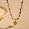 Wholesale Fashion Stainless Steel Inlaid Pearl Coin Pendant Necklace With Snake Bone Chain And Geometric Pattern And Electroplating Treatment