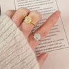 Wholesale Female Copper Electroplated Rotating Zircon Sunflower Geometric Ring For Decompression And Antianxiety
