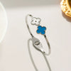 Wholesale Female Fashion Fourleaf Flower Titanium Steel Open Bracelet With Polishing Treatment And Nonfading Feature