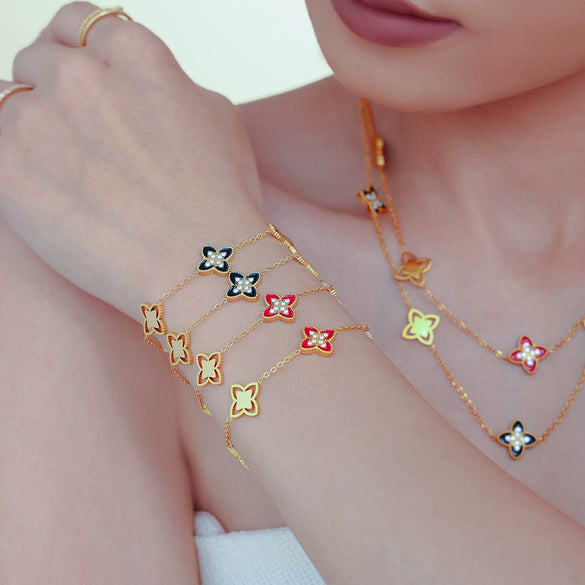 Wholesale Fourleaf Flower Dripping Oil Zircon Full Diamond Titanium Steel Bracelet Necklace For Girls With Electroplating Design