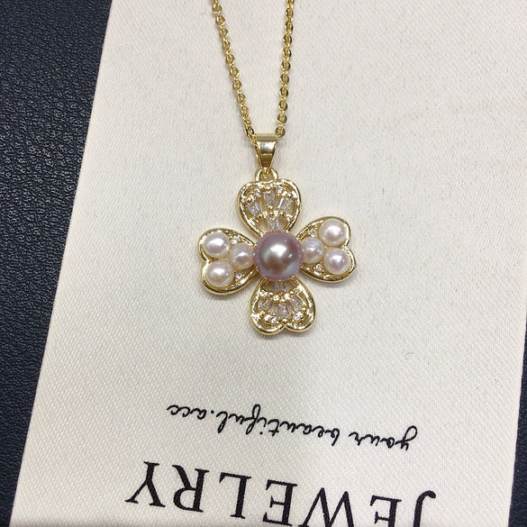 Wholesale Freshwater Pearl Necklace With Copper Accessories And Four Leaf Clover Zircon Pendant Flat Round And Bun Round Pearl Shapes Fashion And Minimalist Style