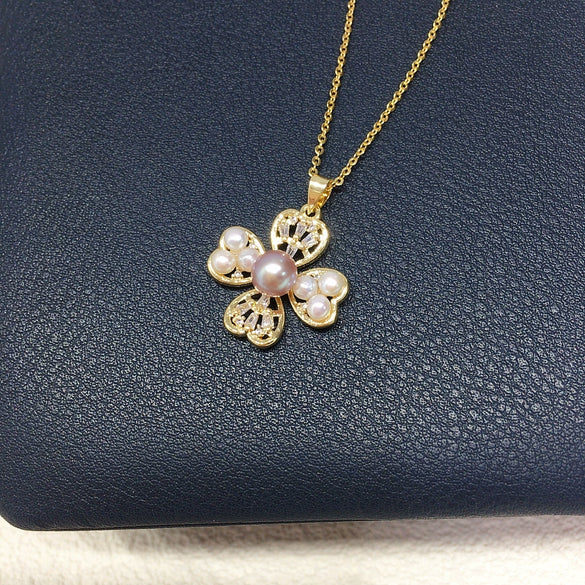 Wholesale Freshwater Pearl Necklace With Copper Accessories And Four Leaf Clover Zircon Pendant Flat Round And Bun Round Pearl Shapes Fashion And Minimalist Style