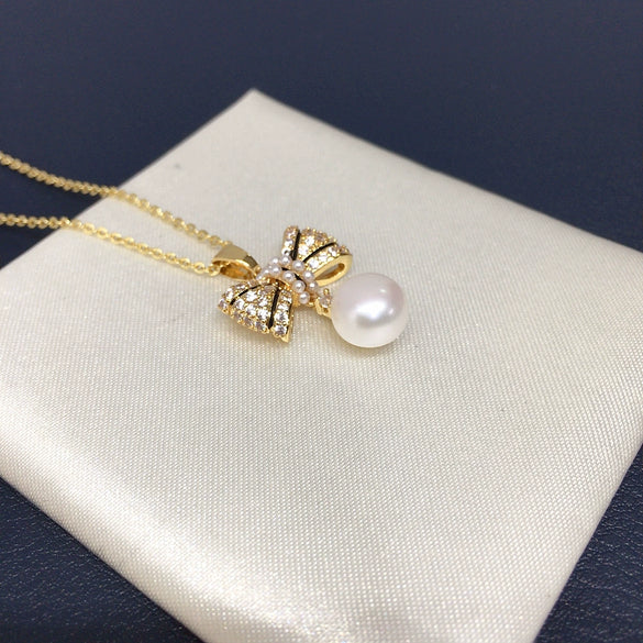 Wholesale Freshwater Pearl Necklace With Copper Microinlaid Zircon Bow Pendant Flat Round And Bun Round Shapes Fashion And Minimalist Style
