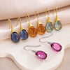 Wholesale Gems Inlaid Drop Shaped Imitation Cat's Eye Stone Fashion Earrings With Electroplating