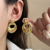 Wholesale Geometric Asymmetrical Spiral Pattern Titanium Steel Earrings With Electroplating Design