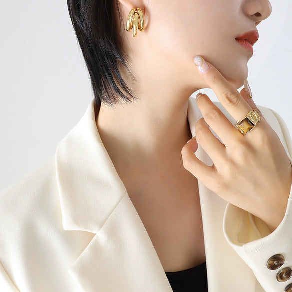 Wholesale Geometric Cshaped Hollow Round Tube Goldplated Titanium Steel Earrings With Niche Design