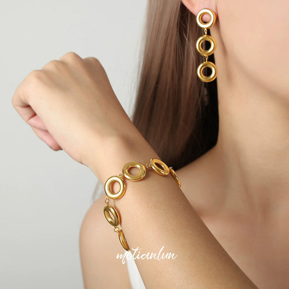 Wholesale Geometric Glossy Ring Stitching Design Titanium Steel Goldplated Unisex Jewelry Suit With Earrings