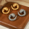 Wholesale Geometric Titanium Steel Goldplated Earrings With Line Twist Swing Design For Unisex