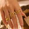 Wholesale Geometric Winding Hollow Cross Line Ring Titanium Steel 18K Gold Electroplated Jewelry For Women