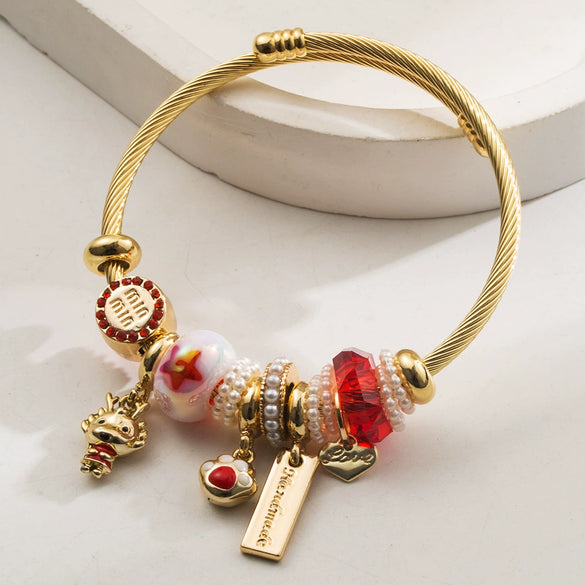 Wholesale Golden Stainless Steel Alloy Women's Bracelet With Diamond Treatment And Small Animal Pendant