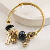 Wholesale Golden Stainless Steel Alloy Women's Bracelet With Diamond Treatment And Small Animal Pendant