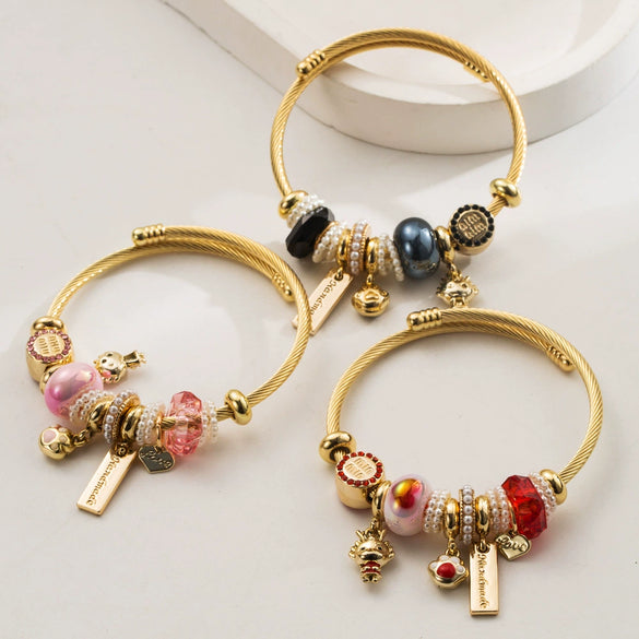 Wholesale Golden Stainless Steel Alloy Women's Bracelet With Diamond Treatment And Small Animal Pendant
