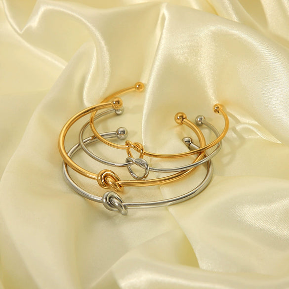 Wholesale High End Niche Design Glossy Knotted Stainless Steel Bracelet With 18K Gold Plated Color Preserving Vacuum Real Gold Electroplating In Pvd Furnace