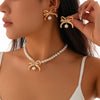 Wholesale Imitation Pearl And Alloy Ball Bead Chain Bow Collarbone Necklace With Electroplating Treatment Light Luxury Style