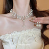 Wholesale Imitation Pearl Water Drop Love Bell French Retro Clavicle Chain Necklace And Earrings Set With Pearls