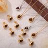 Wholesale Irregular Small Gold Bean Pendant Inlaid With Natural Tiger's Eye Stone Titanium Steel Earrings And Necklace Suit With Niche Design And Electroplating