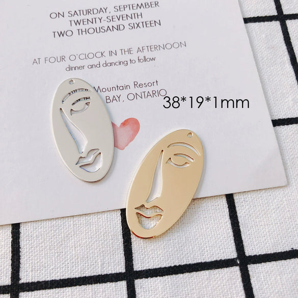 Wholesale Jewelry Accessories Alloy Electroplated Abstract Face Pendant Earrings