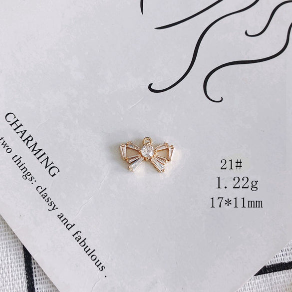 Wholesale Jewelry Accessories Copper Zircon Inlaid Star Bow Four Leaf Clover Hollow Pendant