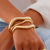Wholesale Jewelry Alloy Geometric Hollow Pleated Ring And Irregular Cambered Bracelet Set With Electroplating