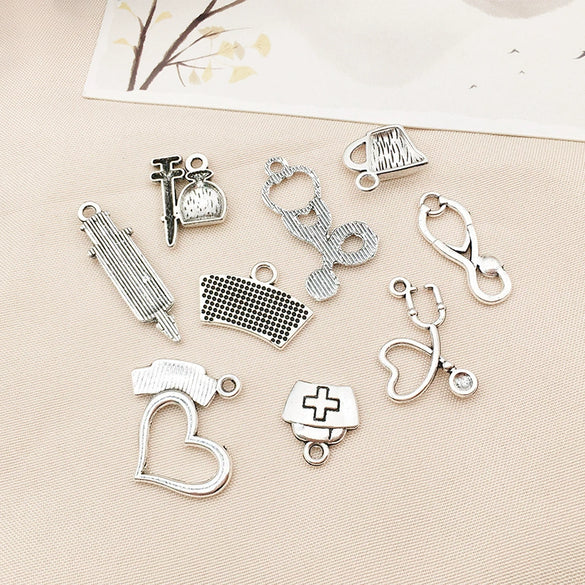 Wholesale Jewelry Alloy Simple Style Electroplated Syringe Stethoscope Ambulance Nurse Cap Electrocardiogram Double Rod Shaped Bracelets Necklaces Pendants Accessories