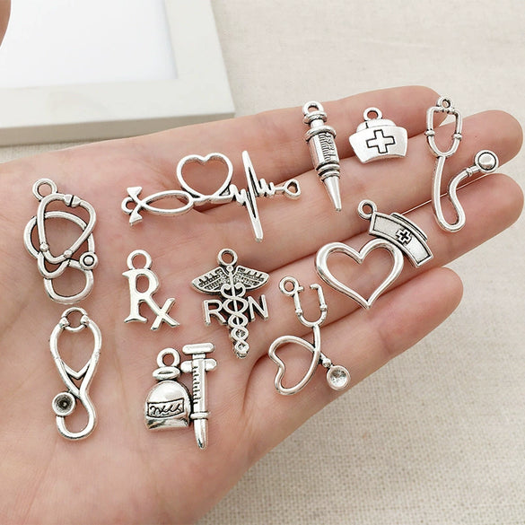 Wholesale Jewelry Alloy Simple Style Electroplated Syringe Stethoscope Ambulance Nurse Cap Electrocardiogram Double Rod Shaped Bracelets Necklaces Pendants Accessories