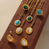 Wholesale Jewelry Retro Style Natural Cat's Eye Stone And Turquoise Titanium Steel Earrings And Necklace With Electroplating