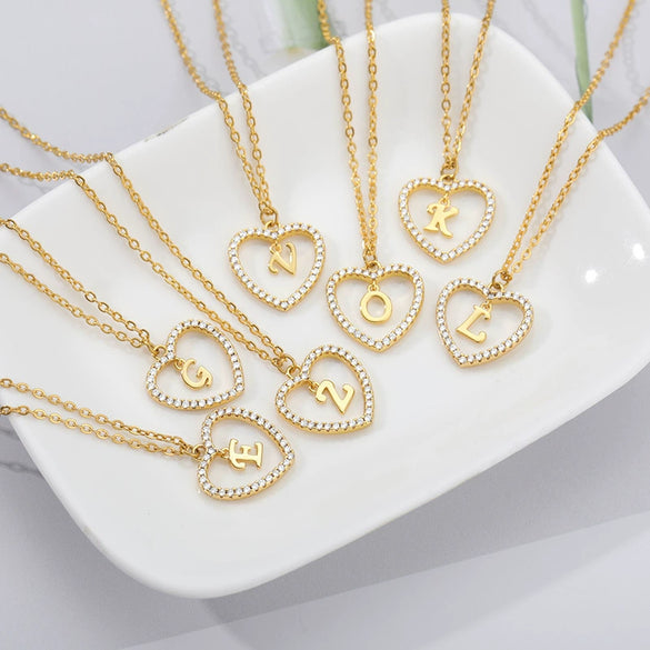 Wholesale Jewelry Simple Geometric Love Hollow Heart Pendant With 26 Letters Copper Zircon Pendant And Stainless Steel Ochain Electroplating Treatment