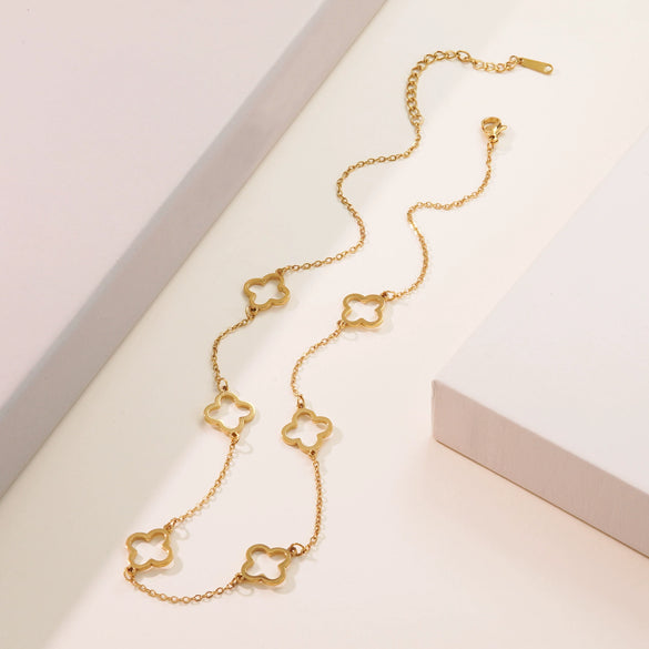 Wholesale Jewelry Suit With Hollow Four Leaf Clover Ring And Earrings In Fashion Style Made Of Stainless Steel With Flower Pattern And Electroplating Treatment