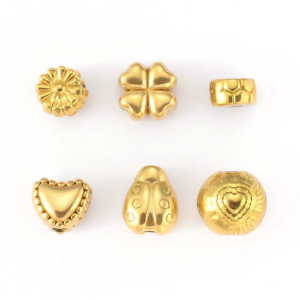 Wholesale Jewelry Titanium Steel Loose Beads Spacer Beads Love Embossed Perforated Fashion Style Drum Beads With Gold Plating