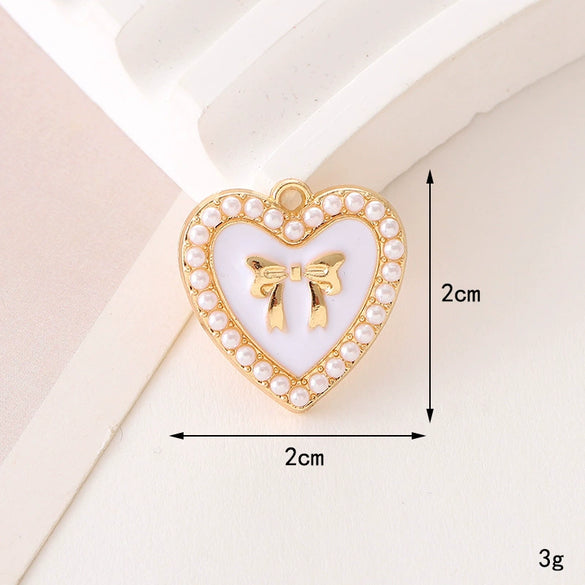 Wholesale Jewelry Zinc Alloy Love Bow Pendant Accessories With Hirback Pattern And Dripping Oil Design For Women