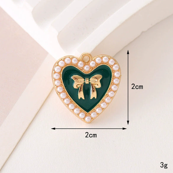 Wholesale Jewelry Zinc Alloy Love Bow Pendant Accessories With Hirback Pattern And Dripping Oil Design For Women