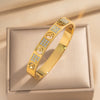 Wholesale 18K Real Gold Electroplated Zircon Letter Cut Out Buckle Titanium Steel Bracelet With Diamond Design For Women