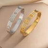 Wholesale 18K Real Gold Electroplated Zircon Letter Cut Out Buckle Titanium Steel Bracelet With Diamond Design For Women