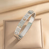 Wholesale 18K Real Gold Electroplated Zircon Letter Cut Out Buckle Titanium Steel Bracelet With Diamond Design For Women