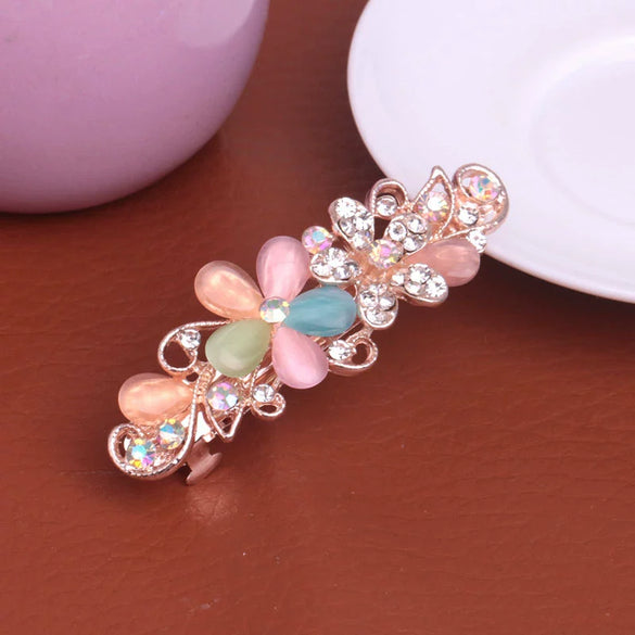 Wholesale Ladies Alloy Flower Rhinestone Cat's Eye Top Clip Hairpin Jewelry With Electroplating