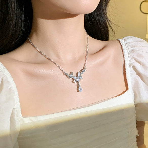 Wholesale Light Luxury Animal Zodiac Titanium Steel Oshaped Chain Necklace With Copper Zircon Inlaid Double Butterfly Tassel Water Drop Pendant For Women