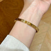 Wholesale Light Luxury Geometric Polish Titanium Steel Crossshaped Bracelet With 18K Goldplated Stainless Steel Clasp For Women