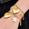 Wholesale Light Luxury Multielement Heart Pendant Necklace And Bracelet Set For Women 18K Goldplated Titanium Steel