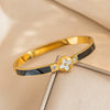 Wholesale Light Luxury Titanium Steel And Stainless Steel Bracelet With Fourleaf Clover Pattern And Electroplating Treatment