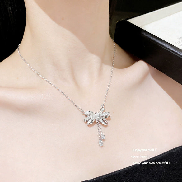 Wholesale Light Luxury Women's Tassel Bow Necklace With Flower Pattern Titanium Steel Oshaped Chain And Copper Zircon Inlaid Pendant