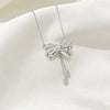 Wholesale Light Luxury Women's Tassel Bow Necklace With Flower Pattern Titanium Steel Oshaped Chain And Copper Zircon Inlaid Pendant