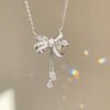Wholesale Light Luxury Women's Tassel Bow Necklace With Flower Pattern Titanium Steel Oshaped Chain And Copper Zircon Inlaid Pendant