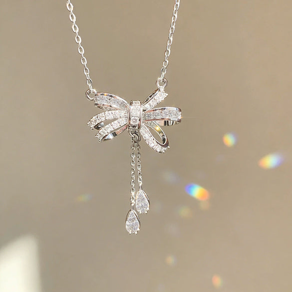 Wholesale Light Luxury Women's Tassel Bow Necklace With Flower Pattern Titanium Steel Oshaped Chain And Copper Zircon Inlaid Pendant