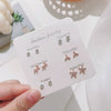 Wholesale Metal Elegant Pearl Bow Love Heart Dripping Oil Earring Set