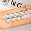 Wholesale Metal Opal Zircon Titanium Steel Heart Shape Cross Screw Stud Piercing Earrings Set With Gems